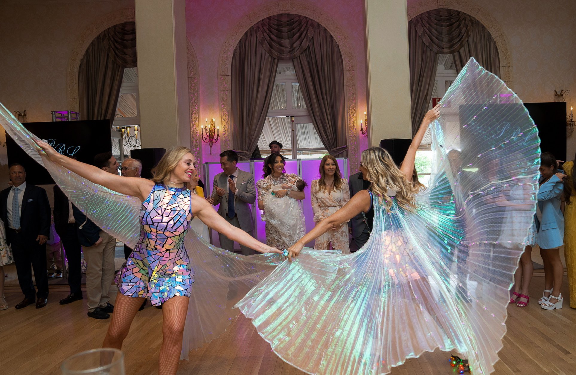 Performers with butterfly wings on the dance floor