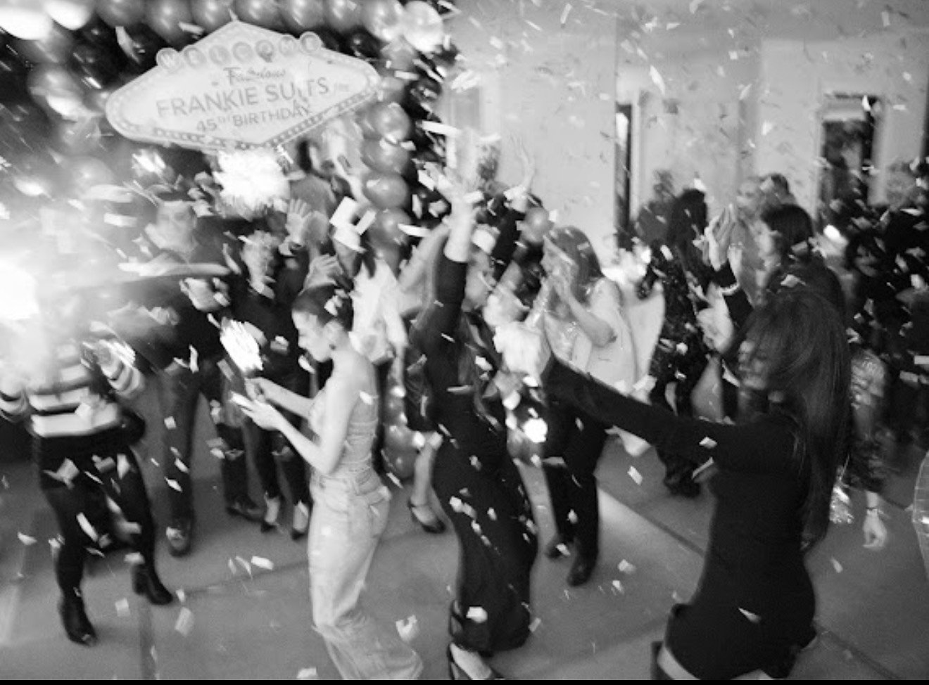 Confetti falling over a crowded dance floor